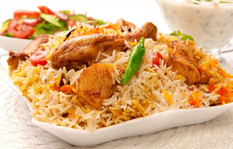 Chicken Biryani is a fragrant, flavorful rice dish layered with spiced chicken.