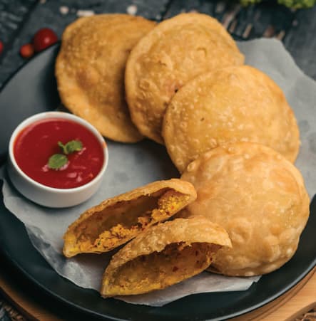 Daal Puri is a soft, fried flatbread stuffed with seasoned lentils.